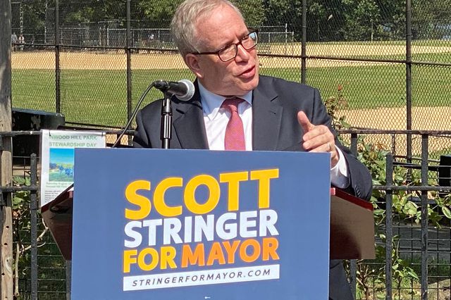 Comptroller Scott Stringer at a podium in Inwood, announcing his run for mayor.